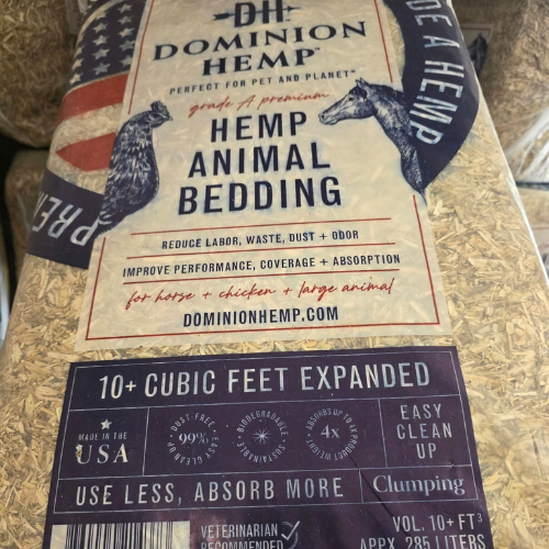 Bag of Dominion Hemp Animal Bedding, labeled for horses, chickens, and large animals. Promises reduced odor and waste with easy clean-up.