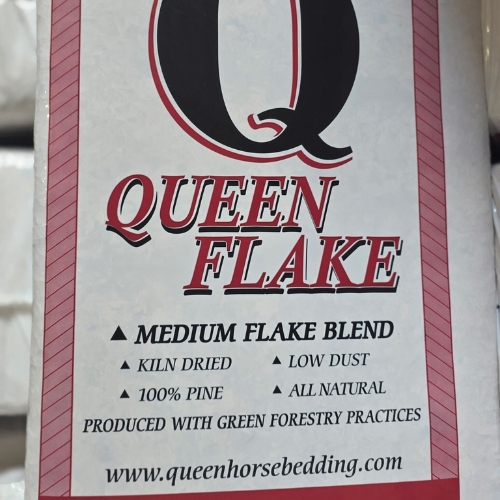 Packaging for Queen Flake horse bedding, featuring a large 