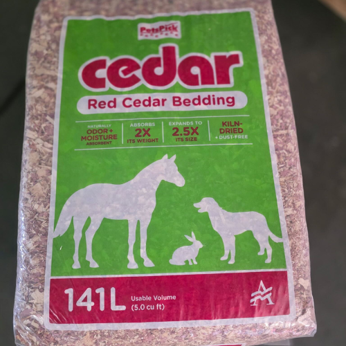 Pack of Pet Pick Red Cedar Bedding with animal silhouettes, including a horse, rabbit, and dog on green background. Features include odor absorption.